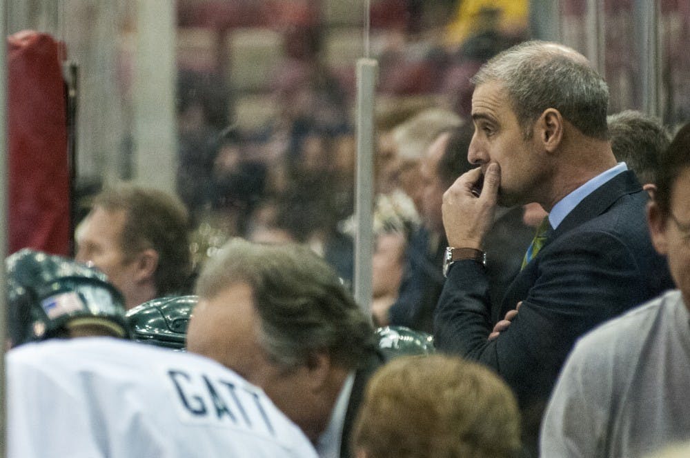 Head coach Tom Anastos thinks during the third period of the 52nd Annual Great Lakes Invitational semifinal game against Western Michigan on Dec. 29, 2016 at Joe Louis Arena in Detroit. The Spartans were defeated by the Broncos, 4-1.