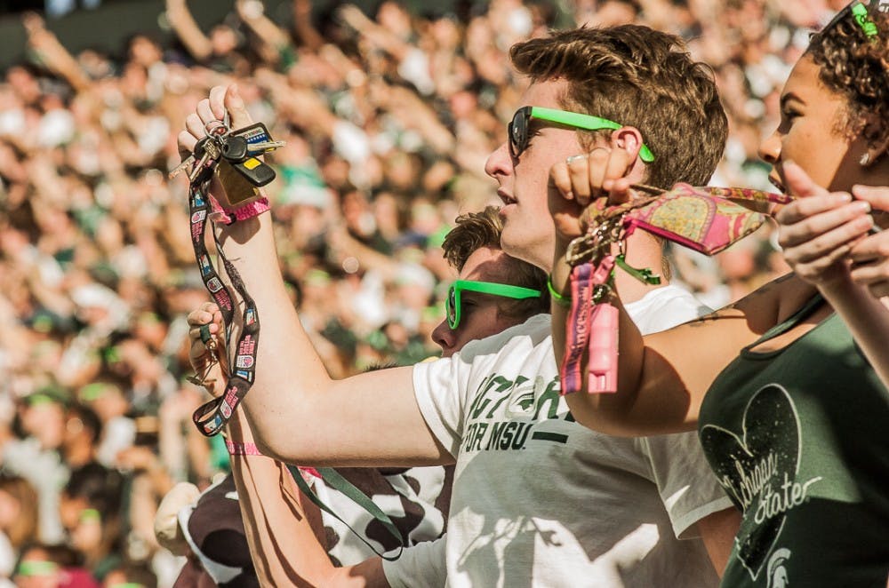 Fans in the student section shake their keys during the game on Oct. 21, 2017. The Spartans defeated the Hoosiers, 17-9. 