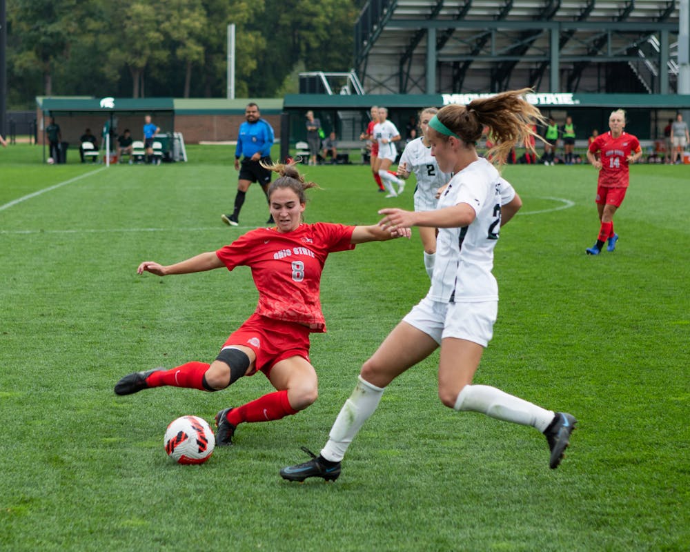 <p>Michigan State women&#x27;s soccer player fights for the ball at the MSU versus OSU game on Oct.10, 2021. </p>