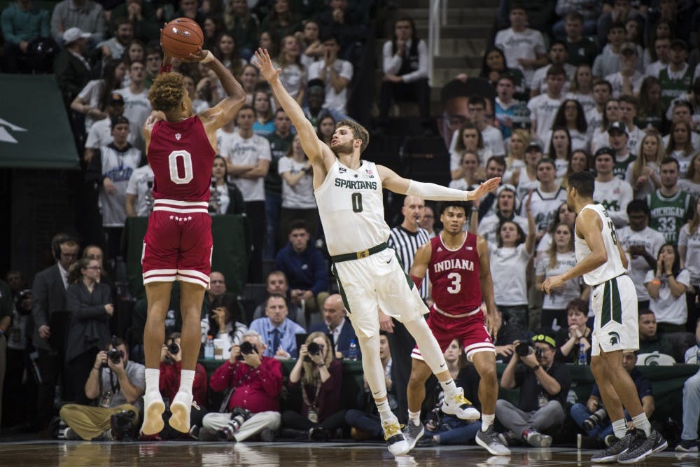 Junior guard Kyle Ahrens (0) covers Indiana guard Romeo Langford (0) during the men's basketball game against Indiana on Feb. 2, 2019 at Breslin Center. Michigan State lost to Indiana in overtime 79-75. Nic Antaya/The State News