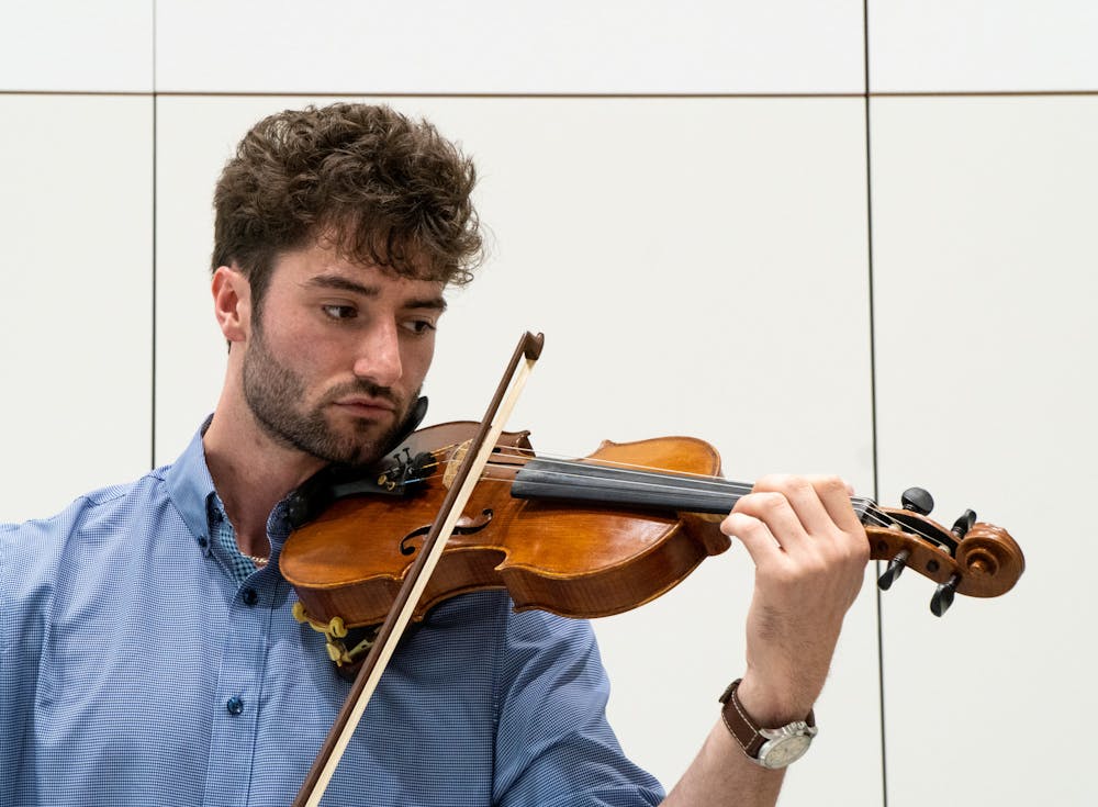 <p>Human biology senior James Cozzi plays his violin in a rehearsal room at Michigan State University&#x27;s College of Music on Sept. 21, 2022. </p>