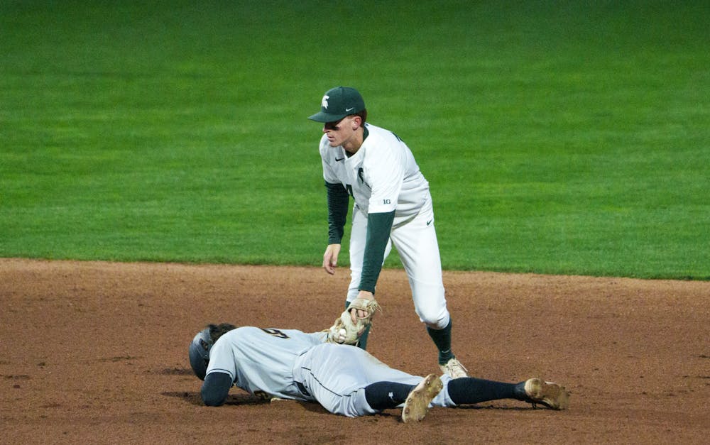 Purdue Fort Wayne junior infielder Jarrett Bickel (9) gets called safe on second after a close call with Michigan State sophomore infielder Mitch Jebb (14) in the top of the eighth. Michigan State won 7-4 against Purdue Fort Wayne at the McLane Stadium, on Apr. 27, 2022.