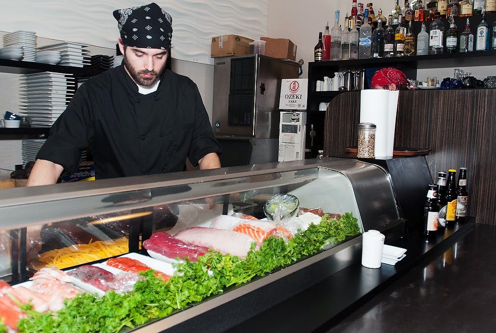 	<p>Sushi chef Caleb Brown preps for dinner service Feb. 19, 2013, at Maru Sushi and Grill, 5100 Marsh Road in Okemos. Maru Sushi and Grill is trying to expand into East Lansing and open a location at 1500 W. Lake Lansing Road. </p>