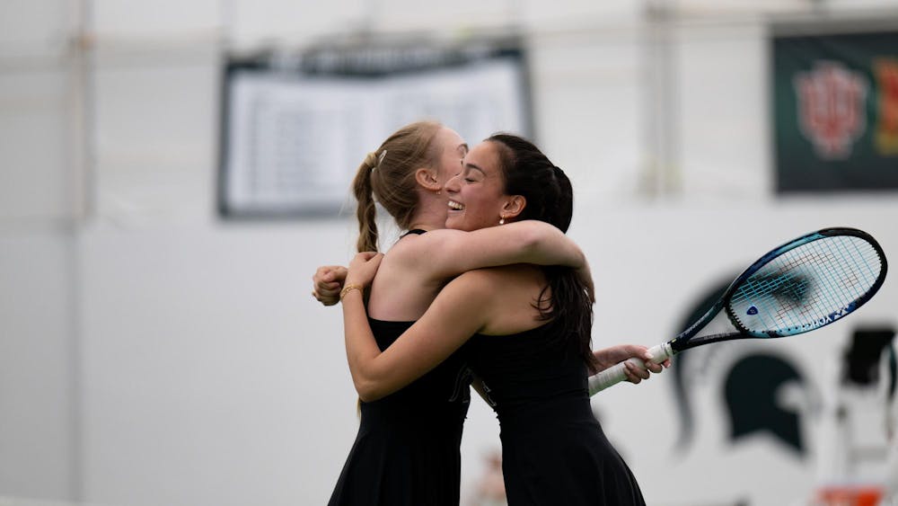 MSU’s Amara Brahmbhatt (sophomore) and Hanna Tsitavets celebrate their doubles victory at the MSU Tennis Complex on Sunday, Mar. 22, 2026.