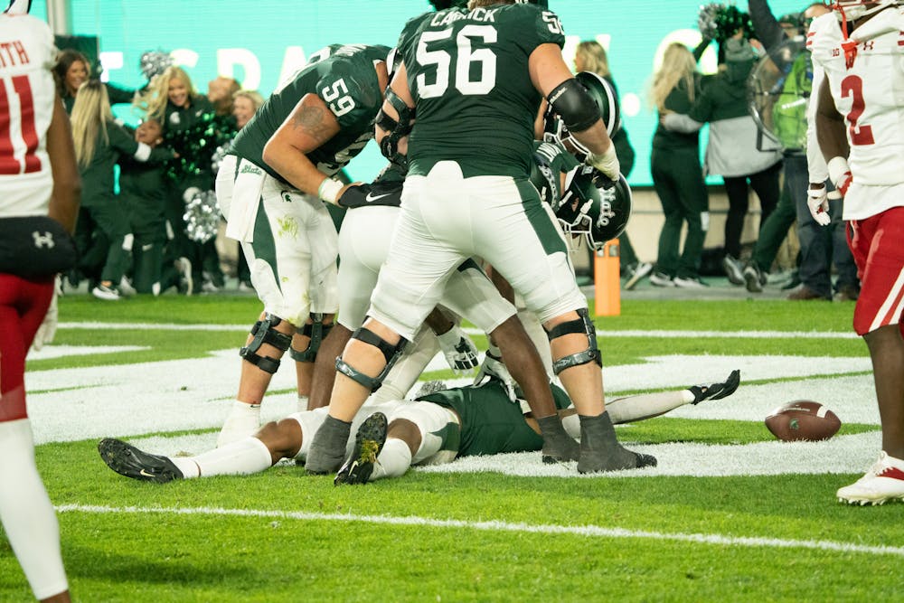 <p>MSU celebrating a touchdown from sophomore wide receiver Keon Coleman. The Spartans took the victory over the Badgers 34-28 at Spartan Stadium on October 15, 2022.</p>