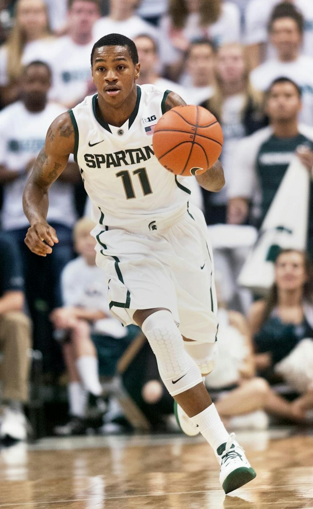 Junior guard Keith Appling dribbles the ball down the court Nov. 2, 2012, at Breslin Center. Appling recorded 13 points during a 62-49 victory over St. Cloud State after the second and final exhibition game of the season. Adam Toolin/The State News