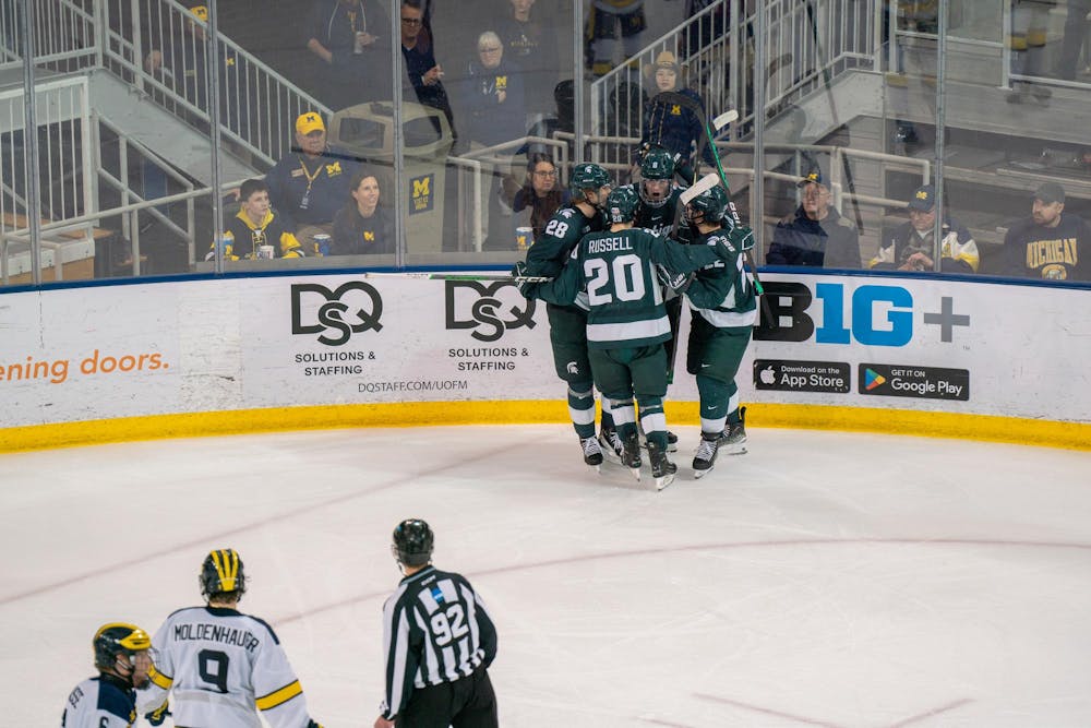 <p>Spartan players celebrate a scored goal by freshman defender Maxim Štrbák (8) during a game against University of Michigan at Yost Ice Arena on Feb. 9, 2024. The Spartans would defeat the Wolverines, 5-1 with all 5 goals coming from different players.</p>