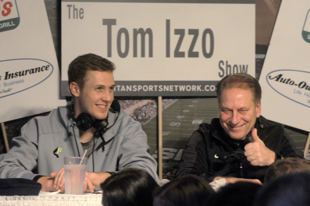 Senior forward Colby Wollenman, left, and mens basketball head coach Tom Izzo interact with the audience during The Tom Izzo Show on Feb. 15, 2016 at Reno's East on 1310 Abbot Road in East Lansing. During this weekly show, Izzo discusses previous and upcoming games for the Spartans. 