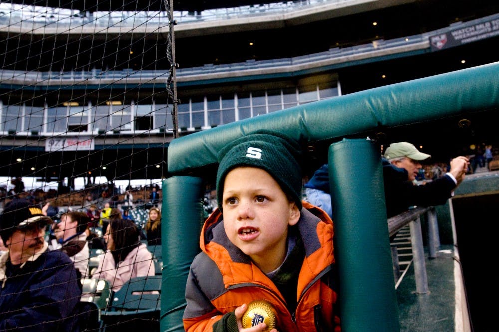 	<p>Grosse Pointe resident Michael McGlinnen, 5, looks at the field Wednesday at Comerica Park in Detroit. Michael&#8217;s father, Michael,  took his son to the Clash at Comerica, a game played between the Spartans and Central Michigan. The McGlinnens, who are &#8220;big Spartan fans,&#8221; according to the elder Michael, cheered their team to a 3-1 victory over the Chippewas. Matt Radick/The State News</p>