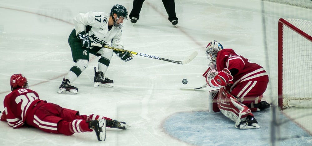 <p>Left wing Taro Hirose (17) takes a shot during the game against Wisconsin Feb. 1, 2019 at Munn Ice Arena. The Spartans beat the Badgers, 4-1.</p>