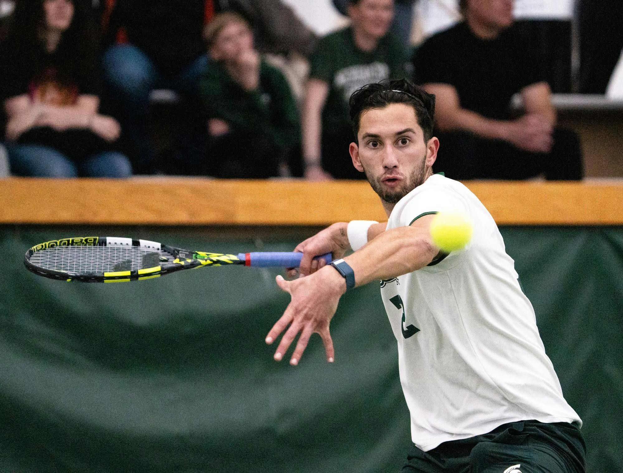 Michigan State junior Ozan Baris prepares with a forehand strike at the MSU Tennis Facility on Mar. 12, 2025