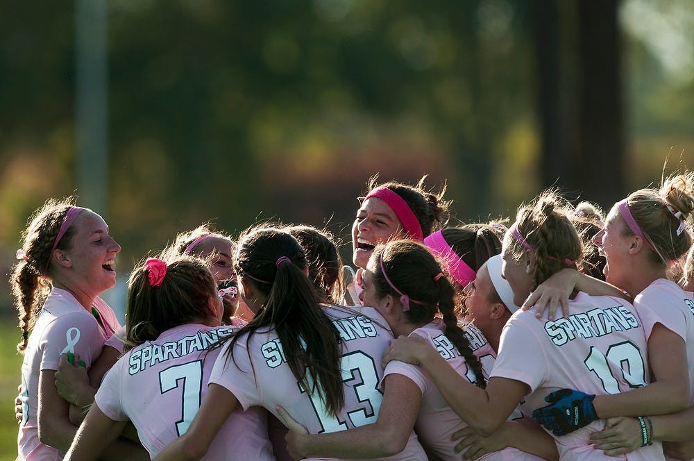 	<p>The field hockey team celebrates after a win in double overtime during the game against Michigan, Oct. 11, 2013, at Ralph Young Field. The Spartans defeated The Wolverines 3-2. Danyelle Morrow/The State News</p>