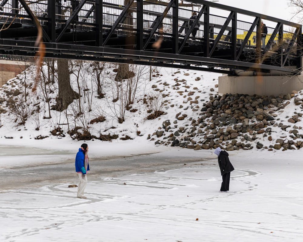 MSU students walk on the frozen Red Cedar River in East Lansing, MI on Feb. 11, 2026.