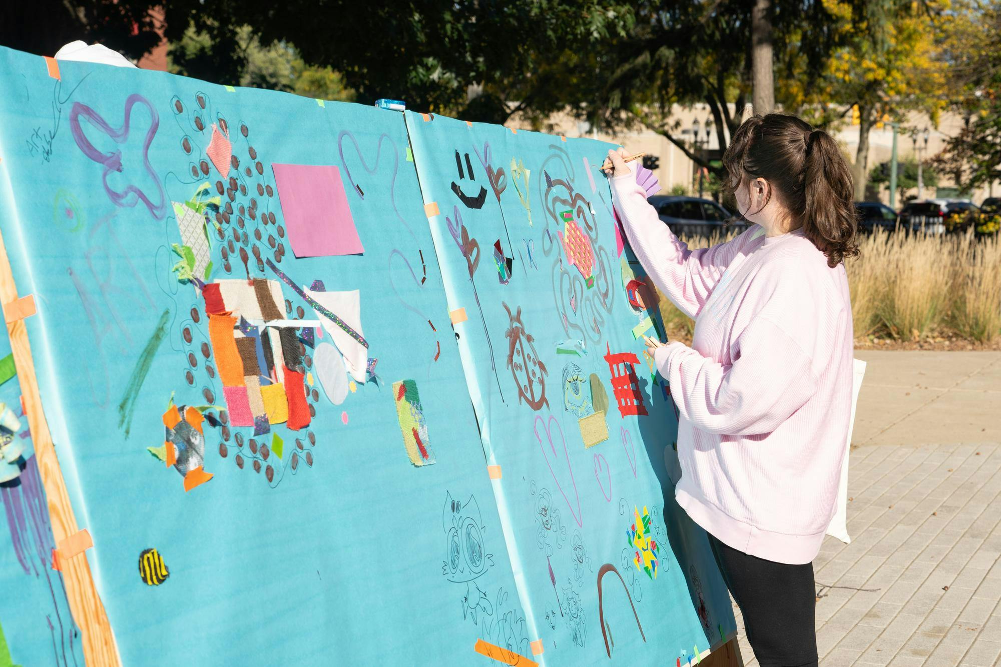 An MSU Drawing Marathon guest adds to a public art space at the Broad Art Museum on Oct. 2, 2024.