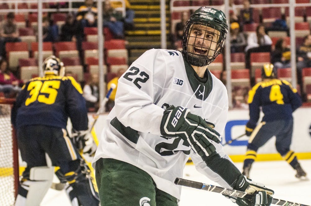 Senior wingman JT Stenglein (22) expresses emotion during the second period of the 52nd Annual Great Lakes Invitational third-place game against the University of Michigan on Dec. 30, 2016 at Joe Louis Arena in Detroit. The Spartans were defeated by the Wolverines in overtime, 5-4.