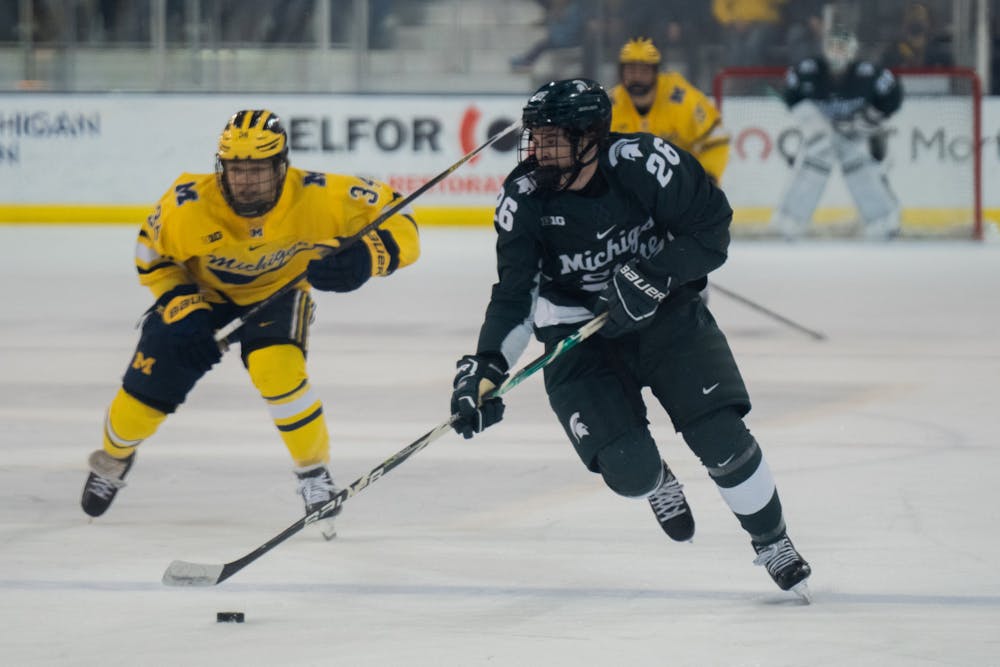 <p>Freshman right-wing Tanner Kelly (26) attempts to score. MSU&#x27;s hockey season came to an end after a 8-0 loss to the University of Michigan in the Big Ten Men&#x27;s Hockey Tournament at Yost Ice Arena on March 05, 2022.</p>