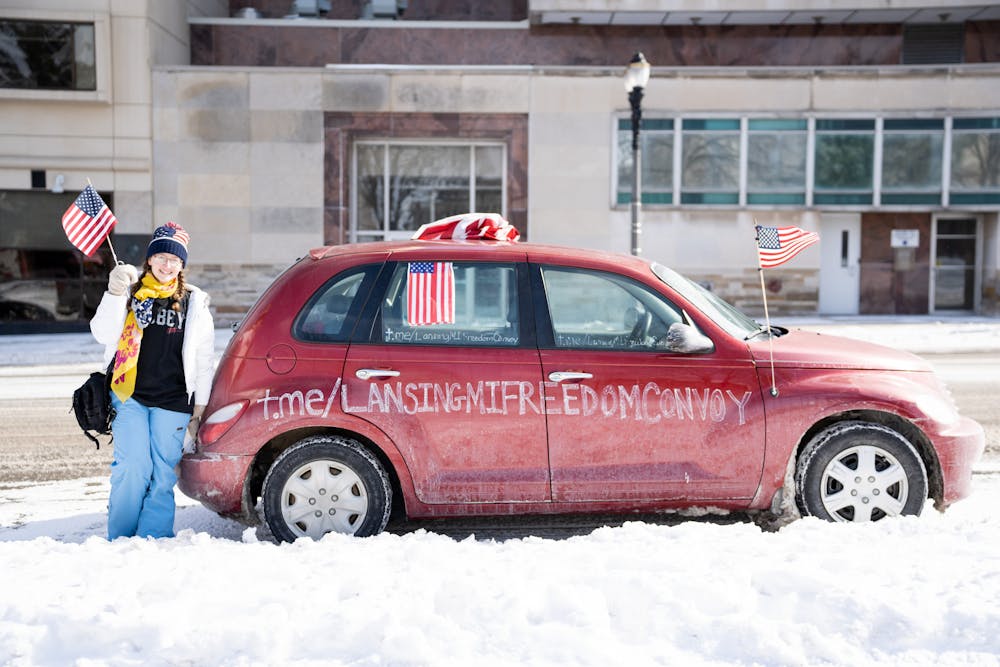 <p>Candace Cook, head of the slow roll, in front of the Lansing Capitol on Feb. 19, 2022.</p>