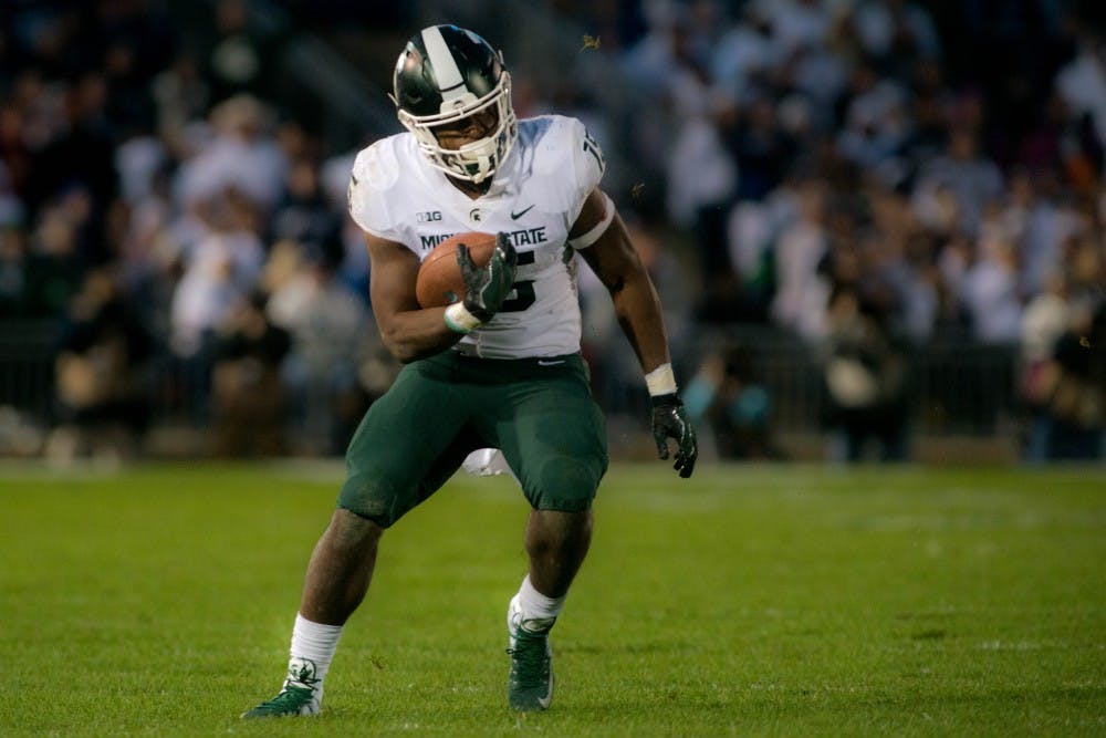 <p>Then freshman running back La&#x27;Darius Jefferson (15) rushes the ball during the game against Penn State at Beaver Stadium on Oct. 13, 2018. The Spartans defeated the Nittany Lions 21-17.</p>