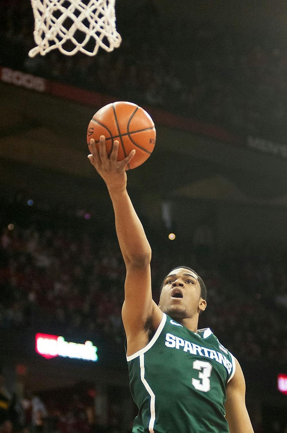 	<p>Freshman guard Alvin Ellis <span class="caps">III</span> goes up for a shot during the game against Wisconsin on Feb. 9, 2014, at Kohl Center in Madison, Wis. The Spartans lost to the Badgers, 60-58. Danyelle Morrow/The State News</p>