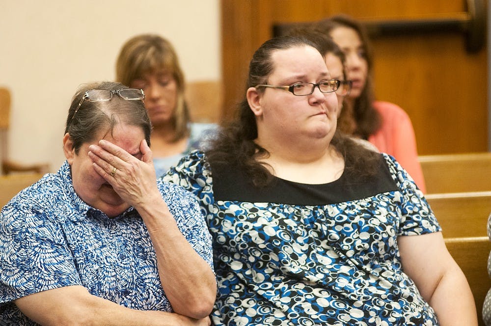 <p>MSU student Dustyn Frolka's stepmother, Eileen Hincka, left, and sister, Colleen Hicka get emotional during the sentencing hearing of Samantha Grigg on May 27, 2014, at Clinton County Circuit Court, 100 Michigan 21, in St Johns, Mich. Frolka was found in February near the I-69 freeway in Bath Township, Mich. Hayden Fennoy/The State News </p>