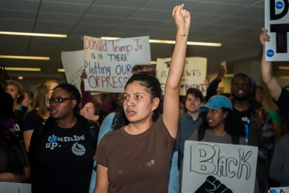 Agribusiness junior Alondra Alvizo leads a protest outside a rally for Donald Trump on Nov. 2, 2016 at the Union. The event was organized by the latino student organization CRU. 