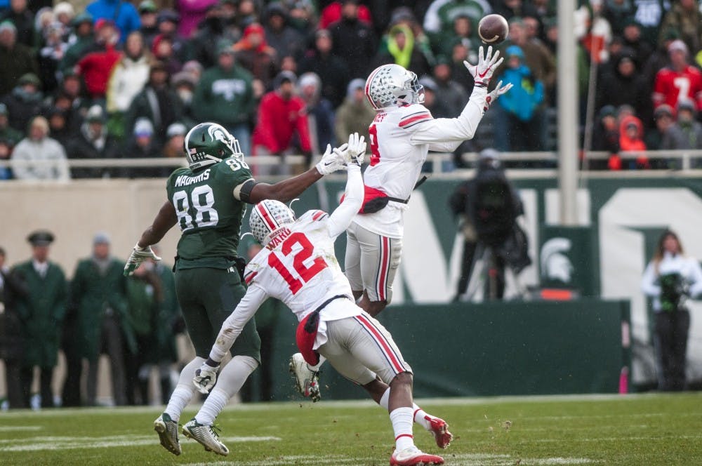 Ohio State cornerback Gareon Conley (8) intercepts a pass intended for senior wide receiver Monty Madaris (88) during the fourth quarter in the game against Ohio State on Nov. 19, 2016 at Spartan Stadium. The Spartans were defeated by the Buckeyes, 17-16.