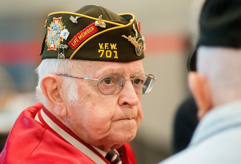 	<p>Lansing resident Wallace Landis, 91, who served in the <span class="caps">WWII</span>, talks with <span class="caps">WWII</span> and Korean War veteran Lewie McKenna, 85, of Lansing, Saturday, Nov 10, 2012, at the annual Capital Area Veterans Day Ceremony at Pattengill Middle School, 626 Marshall St. in Lansing. The two first met in a veteran facility, and have been friends for decades. Justin Wan/The State News</p>