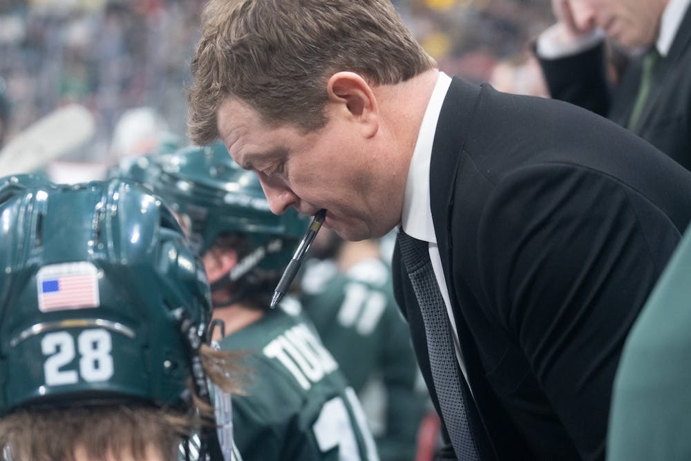 <p>Head Coach Adam Nightingale makes a play during a timeout of the third period during the Duel in the D at Little Caesars Arena on Feb. 11, 2023. The Spartans fell to the Wolverines with a score of 4-3.</p>