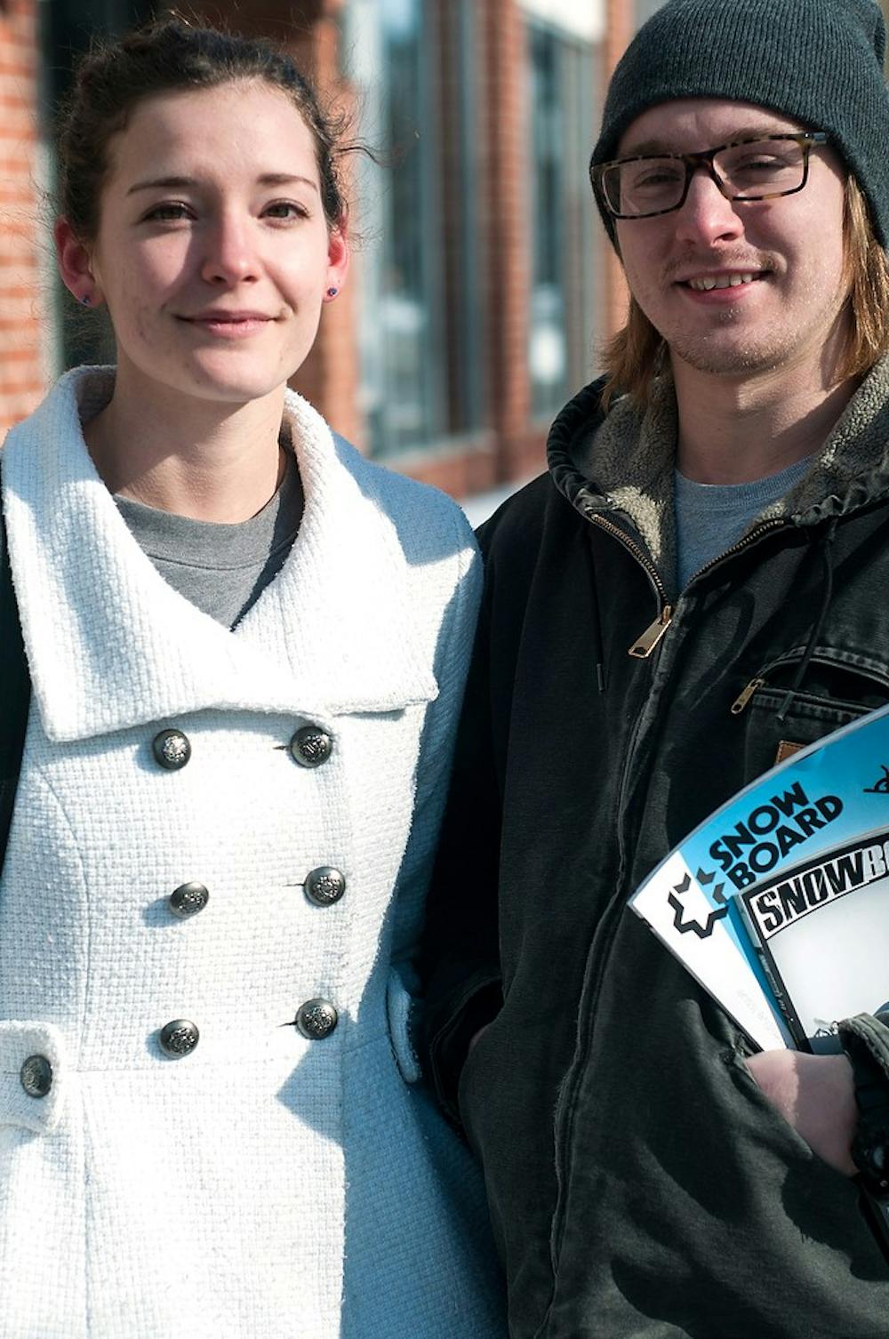 <p>Junior chemistry major Rachel Martin (left) and Lansing resident Kody Sayen pose Feb. 15, 2015, on Grand River Ave. While speaking of their relationship, Martin remarked, "That's why I have him. He kills my spiders". Alice Kole/The State News</p>