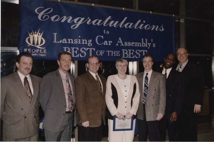 The Fisher Body and Final Assembly Plant Tour Team receives the "Best of the Best Award". From left to right: Craig Konkle, Dave Pardee, Dave Lambright, Virginia Lang, Mike Bentz, James Flowers, John Rosendahl. Photo courtesy of the Lansing Auto Town gallery.