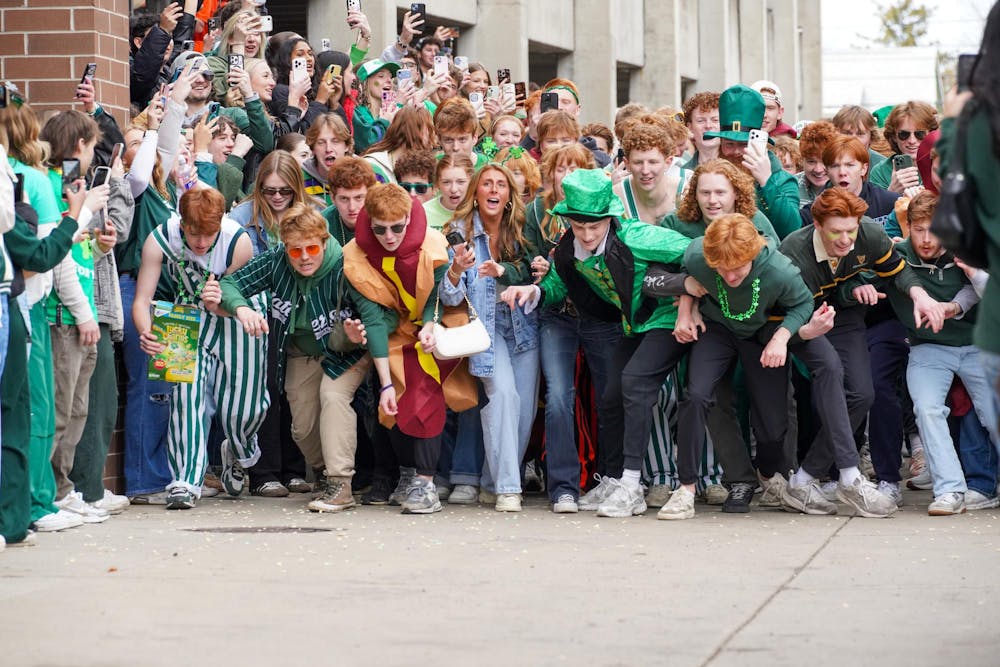 Michigan State University students participate in downtown East Lansing, Mich., for the Ginger Run on Saturday, March 14, 2026.