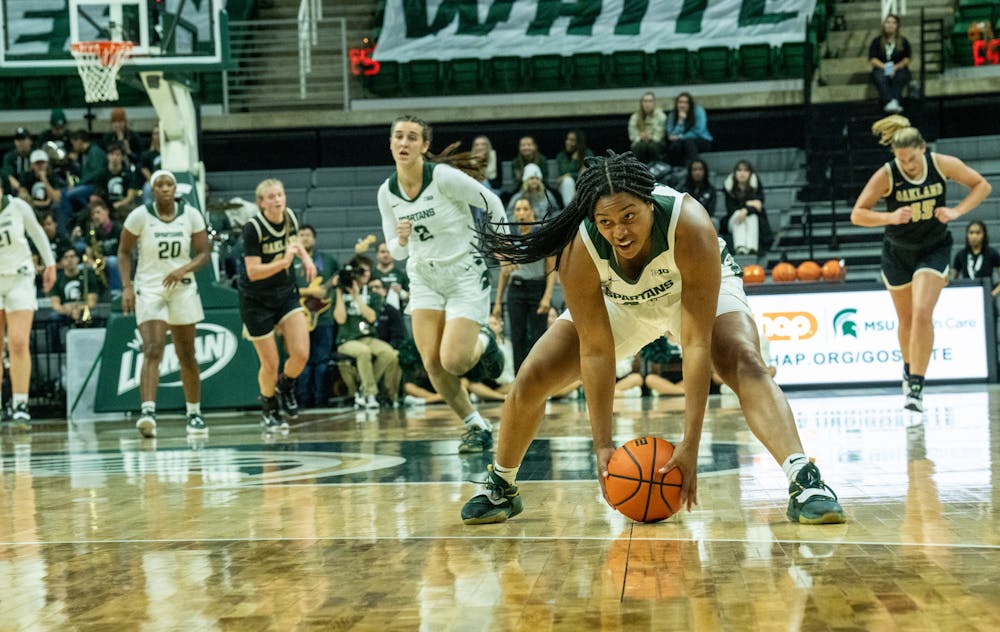 <p>Freshman guard Olivia Porter (42) picks up the ball at the game against Oakland at the Breslin Center on Nov. 15, 2022. The Spartans defeated the Grizzlies 85-39. </p>