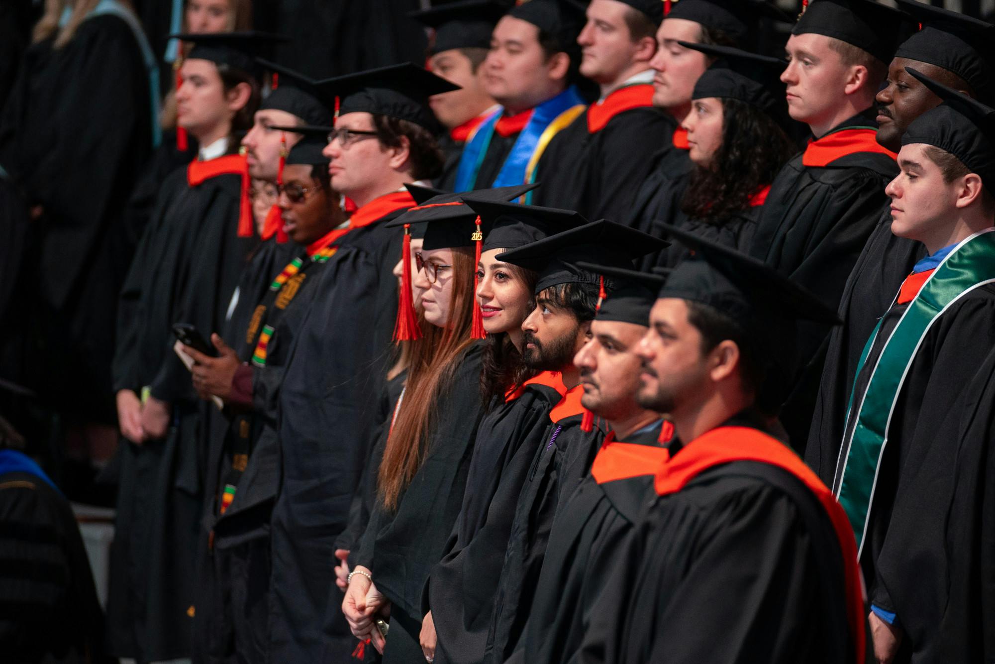 Master's students from the college of engineering standing for recognition during the advanced degree Commencement Ceremony at the Breslin Center on Dec. 12, 2023. 