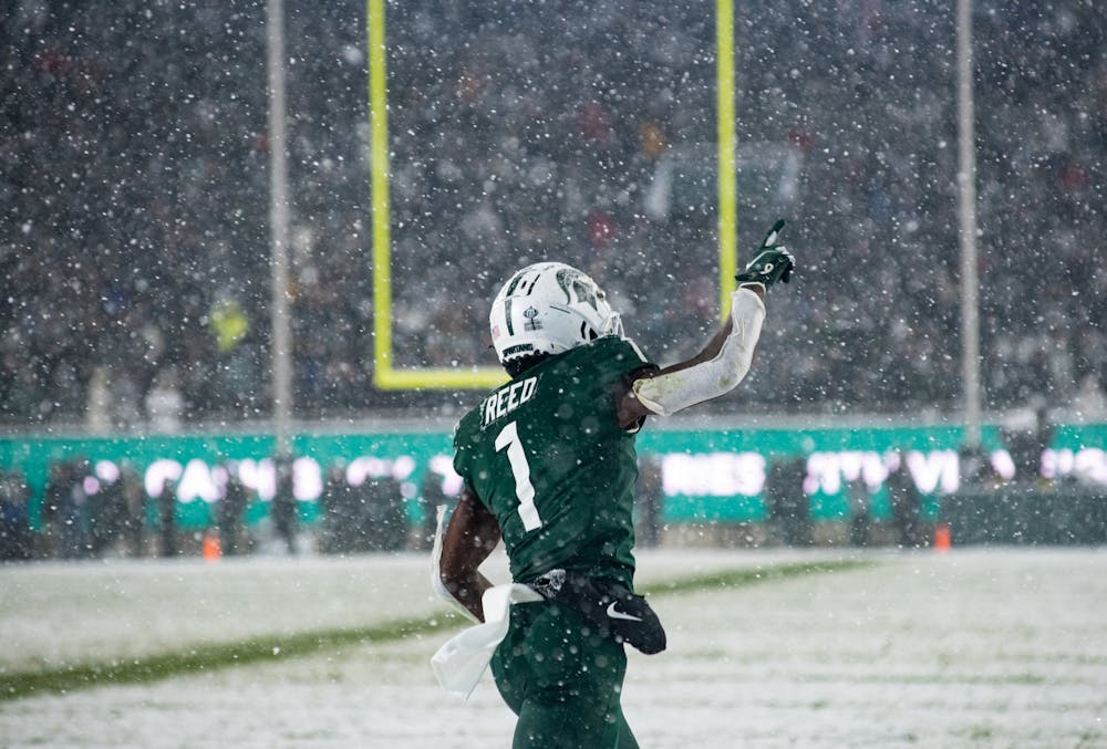 <p>Michigan State redshirt junior wide reciever Jayden Reed (1) celebrates after scoring a touchdown during Michigan State&#x27;s victory over Penn State on Nov. 27, 2021.</p>