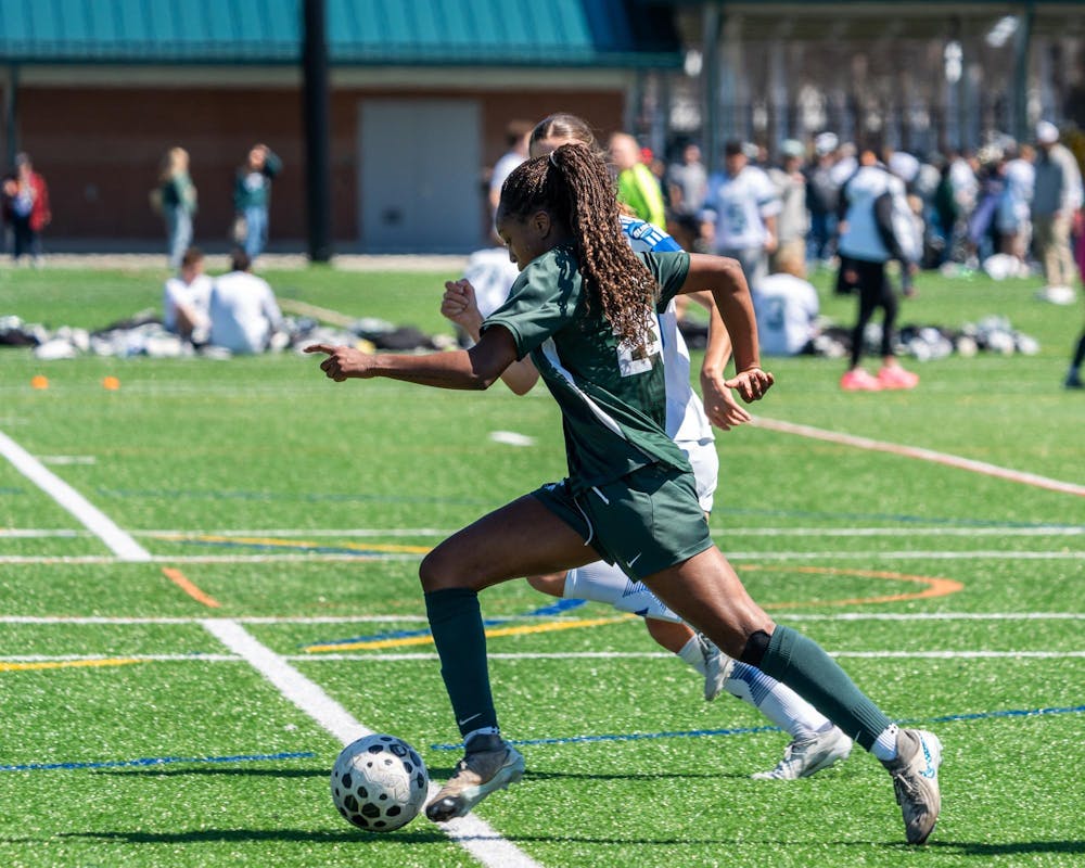 Michigan State senior forward, Kennedy Bell (24), dribbles toward the opposing goalie during the Michigan Spring Cup championship game at the Spartan Greens Turf Complex in East Lansing, MI on April 11, 2026.