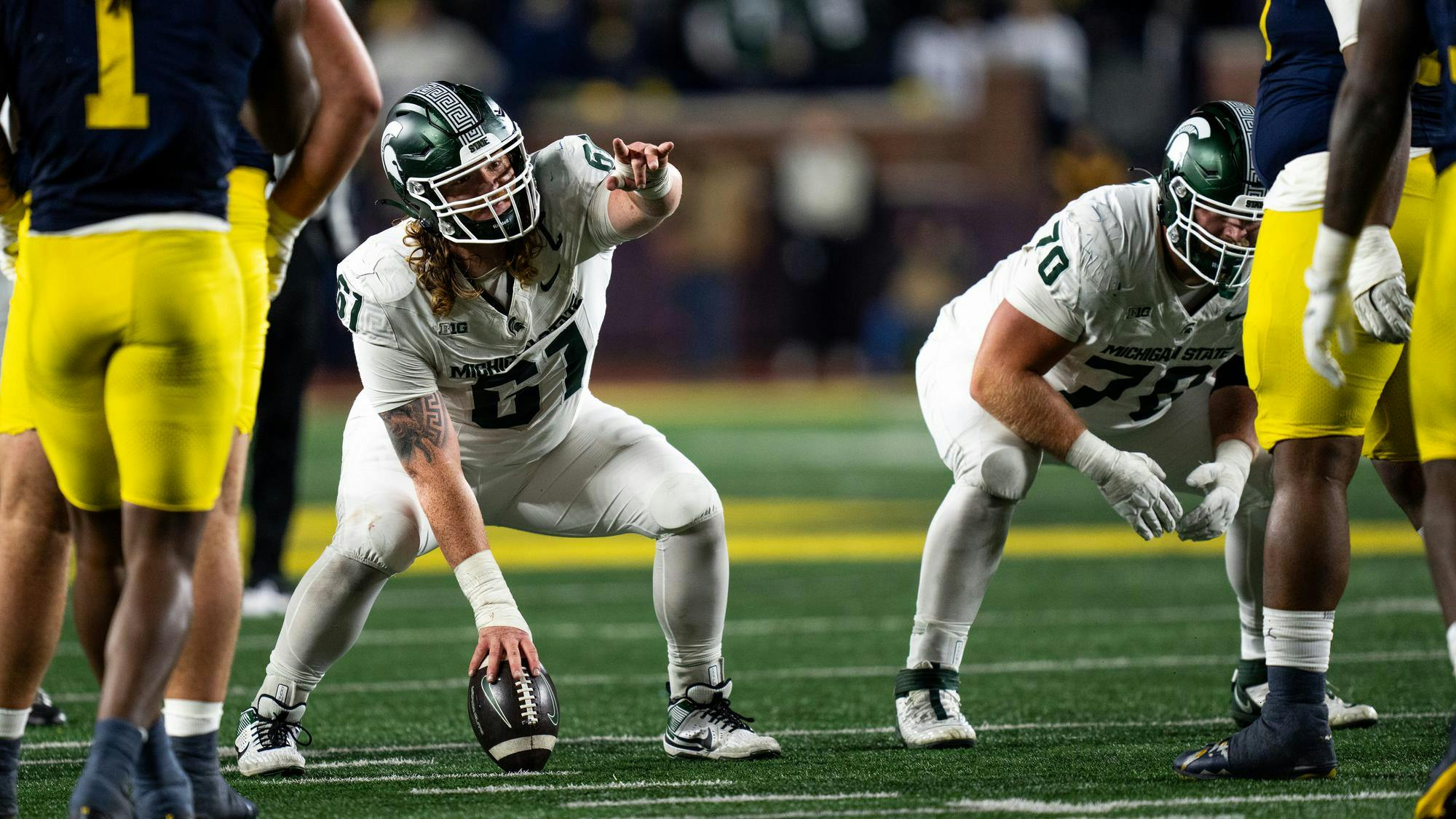 <p>Michigan State freshman center Hayden Lorius (67) prepares to snap the ball against the University of Michigan at Michigan Stadium on Oct. 26, 2024. Penalties cost the Spartans their chance at the Paul Bunyon trophy this year as they fell 24-17 to the rival Wolverines.</p>