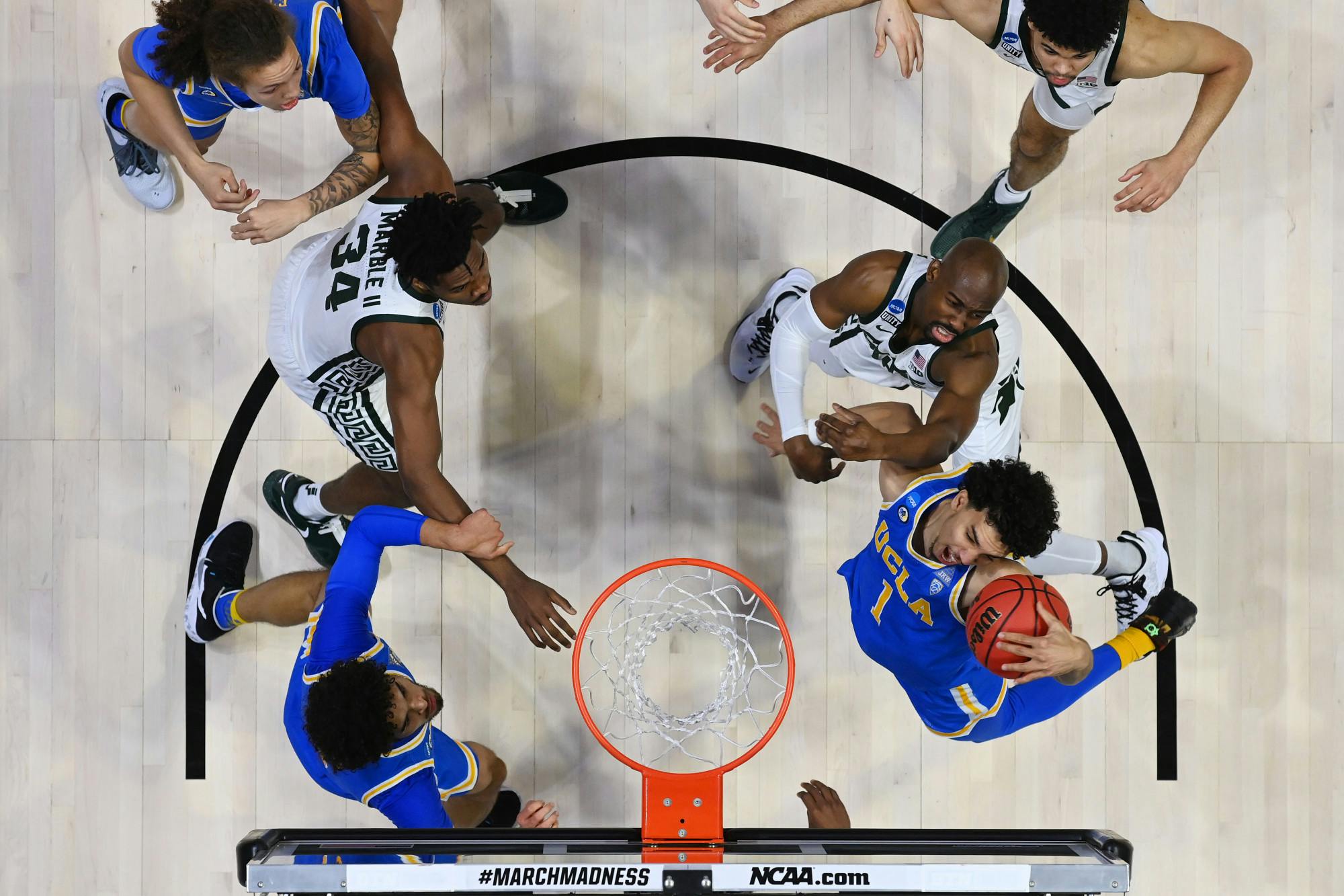 <p>WEST LAFAYETTE, IND. — MARCH 18: Jules Bernard (1) of the UCLA Bruins grabs a rebound against the Michigan State Spartans in the First Four round of the 2021 NCAA Division I Men&#x27;s Basketball Tournament. (Photo credit: Andy Hancock/NCAA Photos via Getty Images)</p>