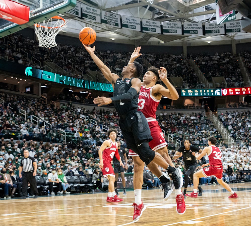 <p>Michigan State junior guard Tyson Walker (2) attempts to shoot the ball during Michigan State&#x27;s victory over Indiana on Feb. 12, 2022.</p>