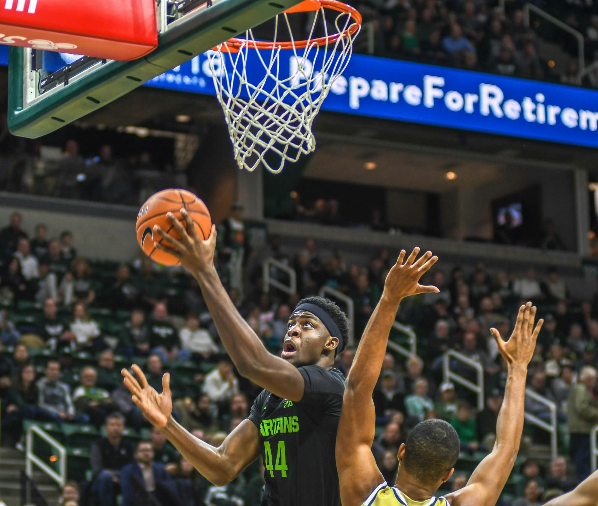 <p>Sophomore forward Gabe Brown (44) dunks the ball during the game against the Charleston Southern Buccaneers on Nov. 18, 2019 at Breslin Center. The Spartans defeated the Buccaneers, 94-46.</p>