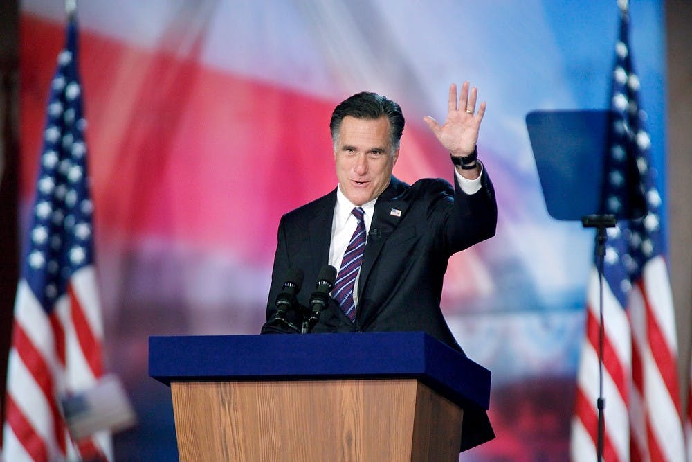 Republican presidential candidate Mitt Romney waves to supporters at the Boston Convention Center in Boston, Massachusetts, after Romney loses the election to incumbent Barack Obama on Tuesday, November 6, 2012. Carolyn Cole/Los Angeles Times/MCT