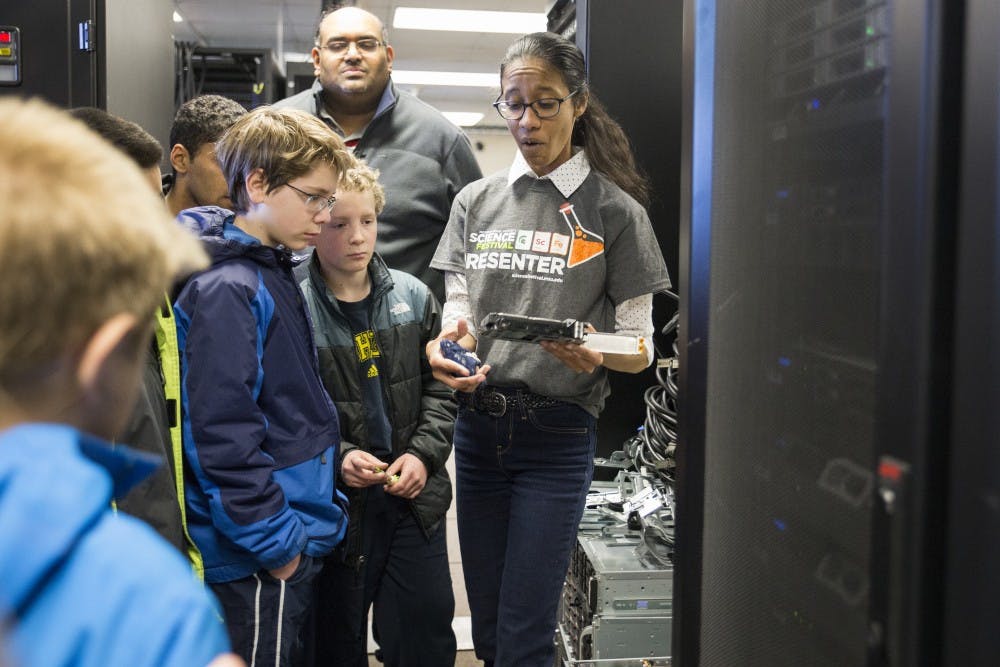 Director of training at ICER Camille Archer explains parts of the supercomputer during the tour of Michigan State's supercomputer on April 7, 2017 at Engineering Building. The tours of the supercomputer called Laconia is a part of the 2017 Science Festival held by the Institute for Cyber-Enabled Research (ICER). 
