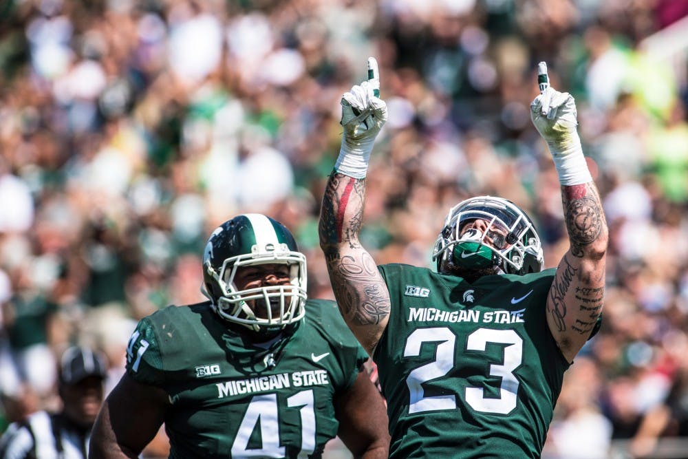 The Spartans celebrate after a touchdown during the game against Bowling Green on Sept. 2, 2017 at Spartan Stadium. The Spartans defeated the Falcons, 35-10. 
