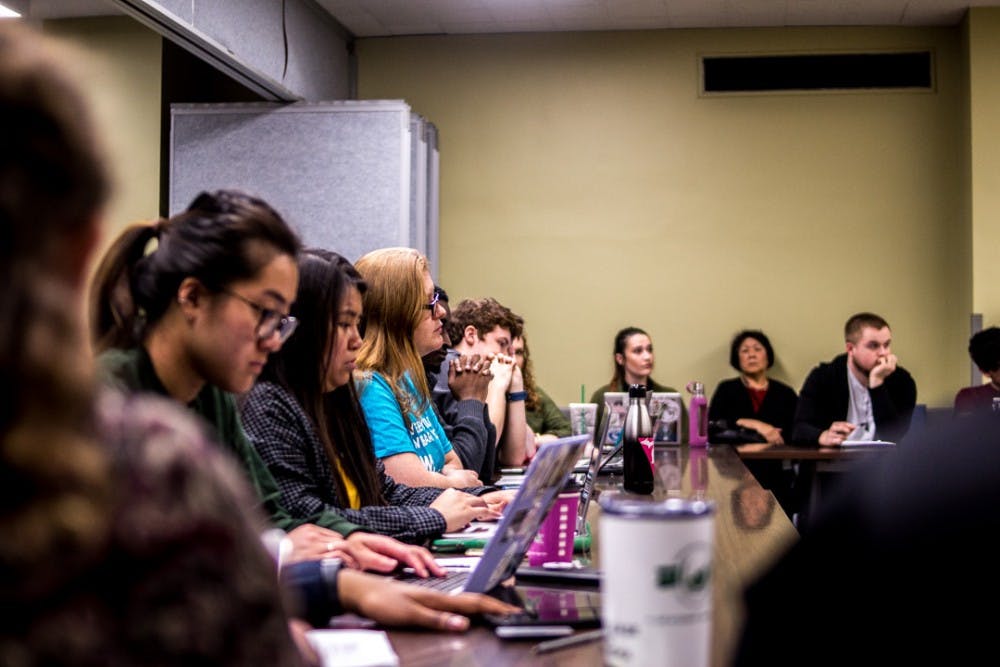 ASMSU representatives listen to interim president John Engler speak during a meeting on March 29, 2018 at the Student Services Building. 