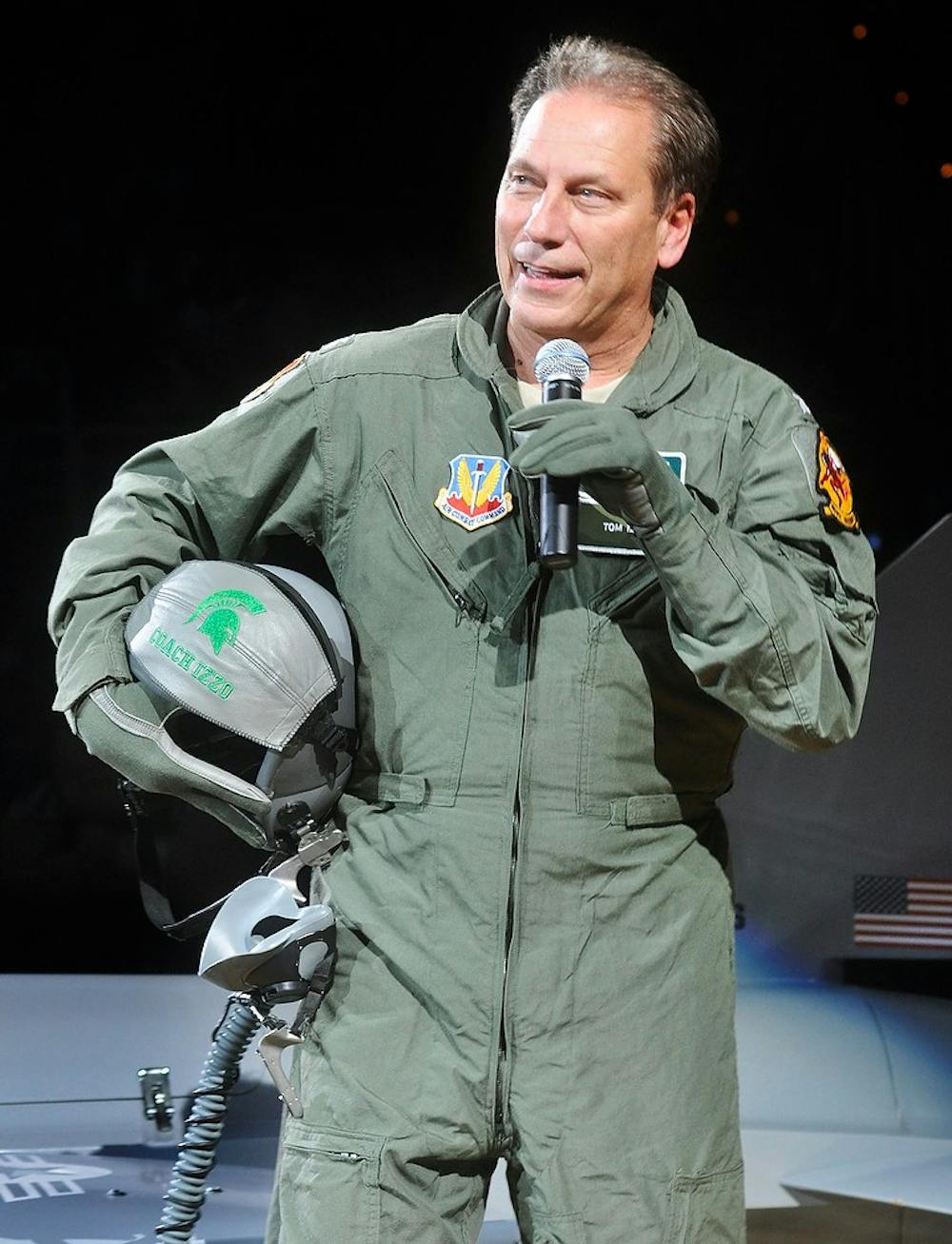 <p>Men's basketball head coach Tom Izzo speaks Friday night during Midnight Madness at Breslin Center after appearing on the floor in a fighter jet model. The annual Midnight Madness marks the official beginning of the basketball program. Justin Wan/The State News</p>