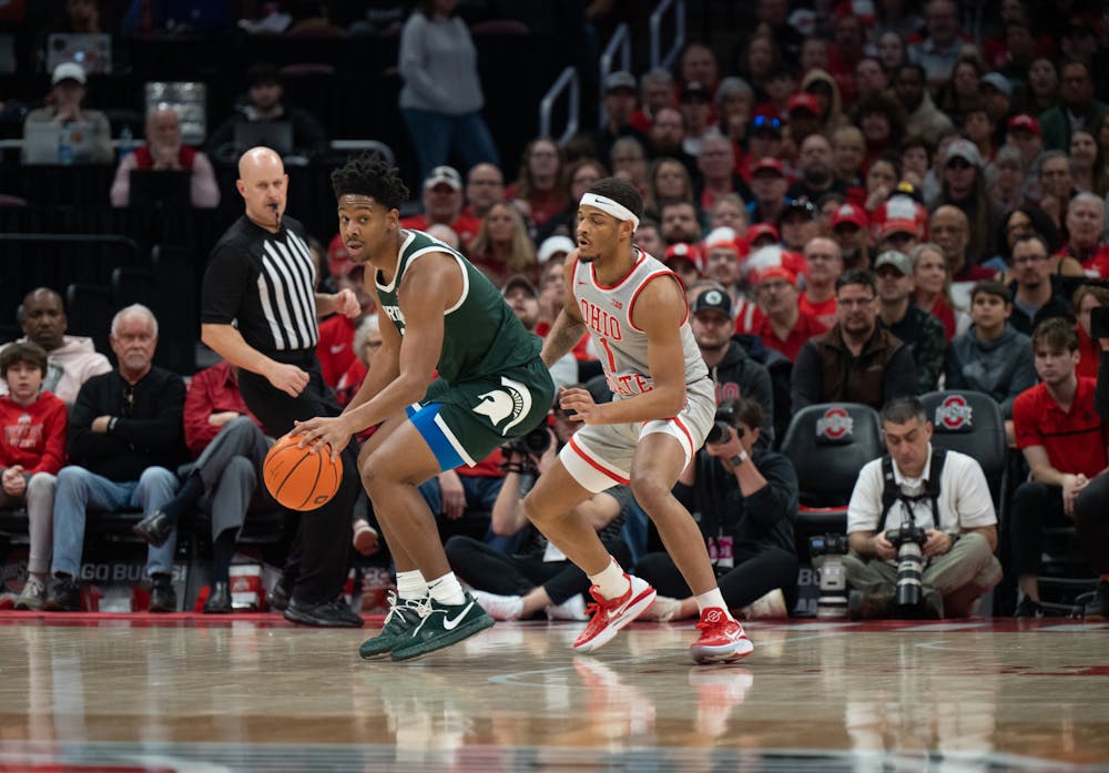 MSU guard A.J. Hoggard (left) evades OSU guard Roddy Gayle Jr. at the Schottenstein Center in Columbus, Ohio on Sunday, Feb. 12, 2023. Hoggard, a junior, put up 6 points in 25 minutes for MSU.