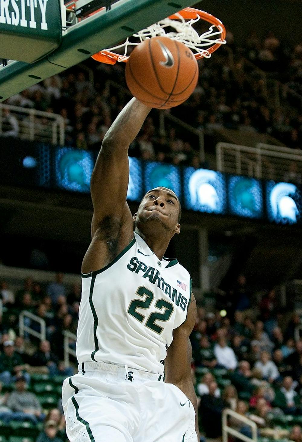 Then-freshman guard Branden Dawson dunks the ball. Dawson had 13 points and three rebounds in the Spartans' 76-41 victory over the Tigers on Nov. 18, 2011 at Breslin Center. State News File Photo