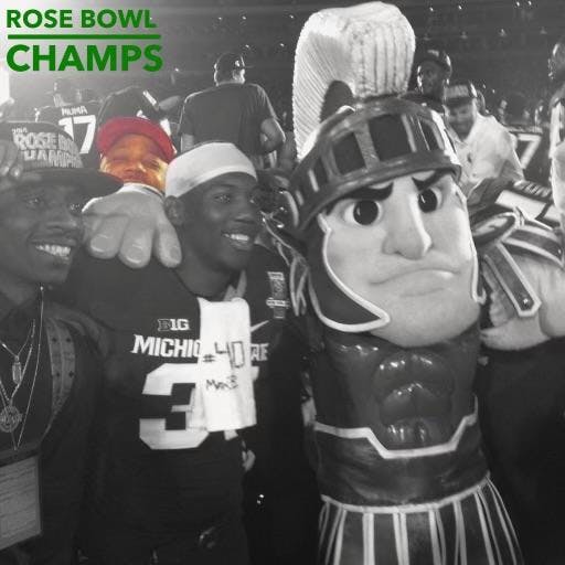 <p>Rapper Rich Homie Quan celebrates with the MSU Football team after the Rose Bowl game on Jan. 1, 2014. Photo courtesy of Taiwan Jones.</p>