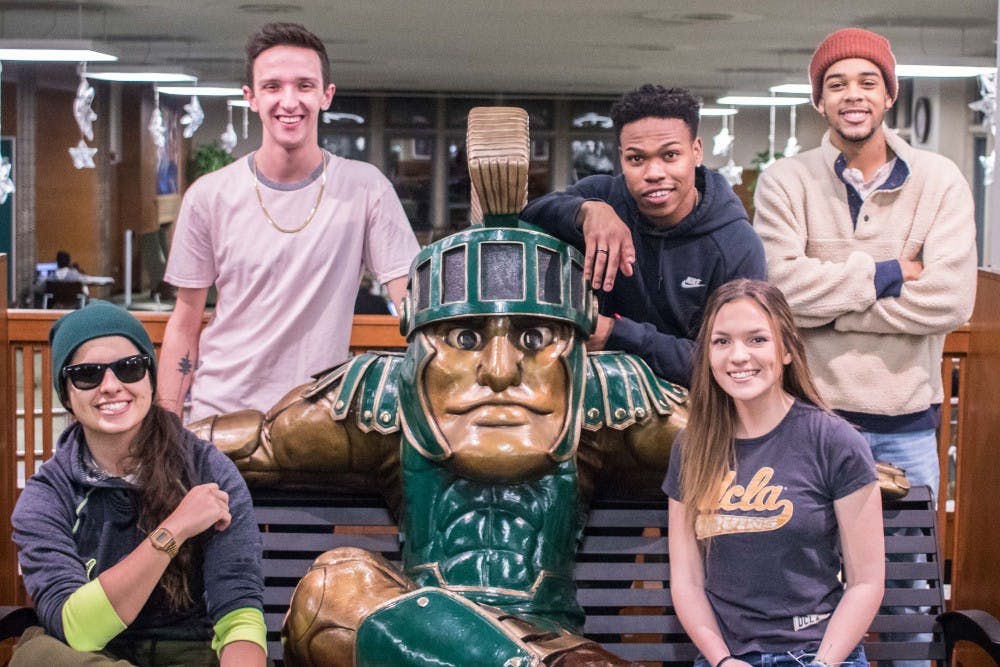 Sara Seryani, Grant Dehner, Michael Small, Ashley Conklin, and Miles Hampton (left to right) of The Sidewalk pose for a photo on Feb. 8, 2018, at the MSU Union.