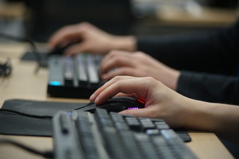 Computer science junior Jeff Pi's hand is pictured as he plays a video game on Feb.18, 2017 at Communication Arts and Sciences Building. The LAN event allows students to play offline and play by connecting their consoles or computer with each other. The LAN events goal is to bring together esports players within the MSU community. 