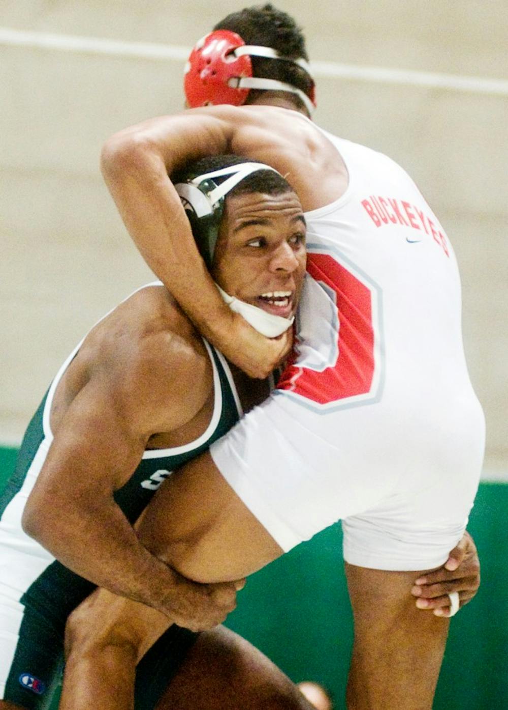 Senior 157-pounder Anthony Jones Jr. tries to use his force to move Buckeye redshirt freshman Josh Demas. The Spartans fell to the Buckeyes 24-13 Sunday afternoon at Jension Field House. Anthony Thibodeau/The State News